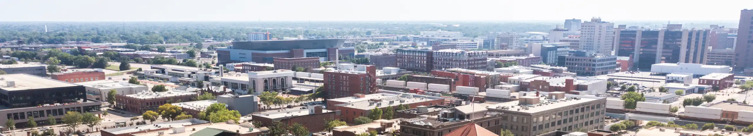 Skyline view of historic old town Wichita, Kansas. American Pest Management serves many areas in Wichita, including Butler County, Hutchinson, Sedgwick County, and Sumner County. Contact us today for your pest control needs.